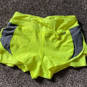 Avia neon yellow with grey accents, size small